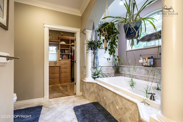17237 E Smith Rd, Palmer, AK 99645 - bathroom with ornate columns, ornamental molding, a bath, and a walk in closet