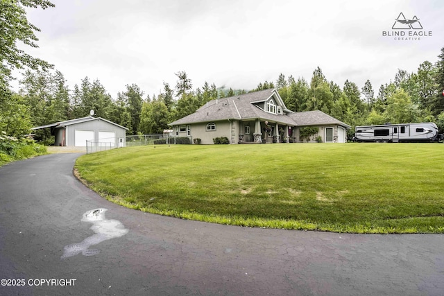 17237 E Smith Rd, Palmer, AK 99645 - view of front of house with a garage, an outdoor structure, and view of scattered trees