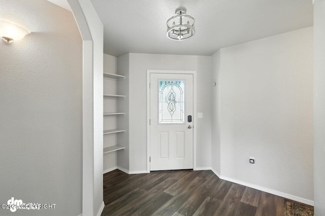 3098 N Lazy Aurora Cir, Palmer, AK 99645 - entryway with dark wood-type flooring and arched walkways