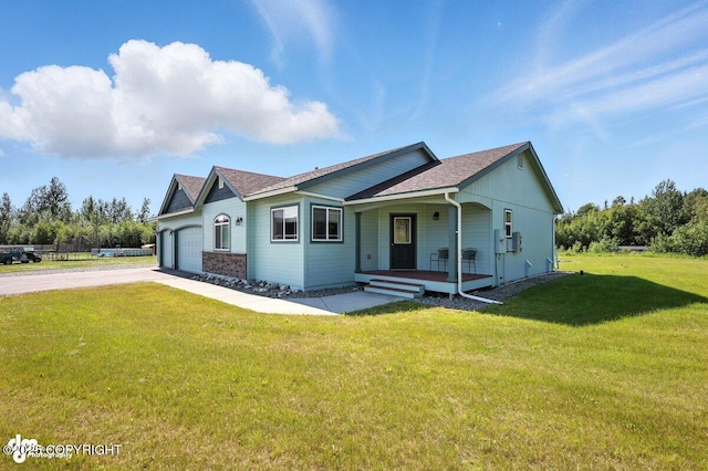 3098 N Lazy Aurora Cir, Palmer, AK 99645 - ranch-style house featuring covered porch, concrete driveway, a garage, a front lawn, and roof with shingles