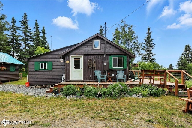 57541 Clam Diggers Ave, Clam Gulch, AK 99568 - back of house featuring a deck and a yard