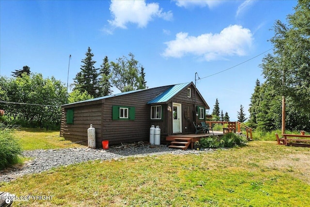 57541 Clam Diggers Ave, Clam Gulch, AK 99568 - back of property with a wooden deck and a yard