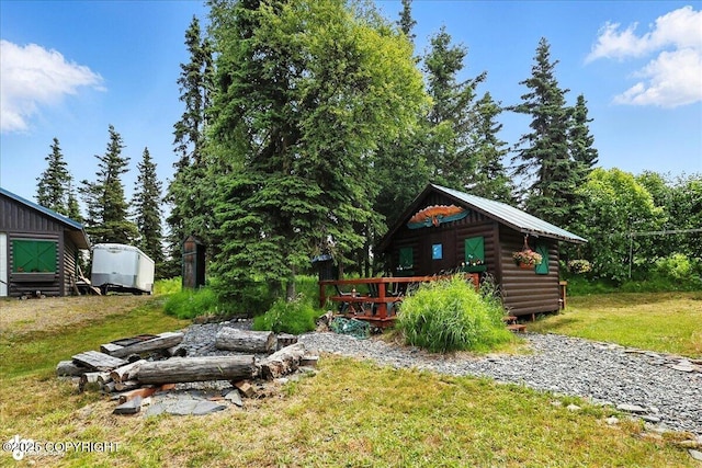 57541 Clam Diggers Ave, Clam Gulch, AK 99568 - view of green lawn featuring an outbuilding