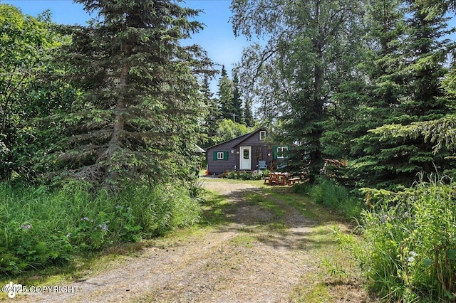 57541 Clam Diggers Ave, Clam Gulch, AK 99568 - view of front of home featuring dirt driveway and a wooded view