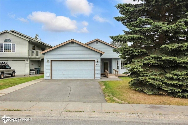 7851 Alpine View Cir, Anchorage, AK 99507 - view of front facade with concrete driveway and a garage