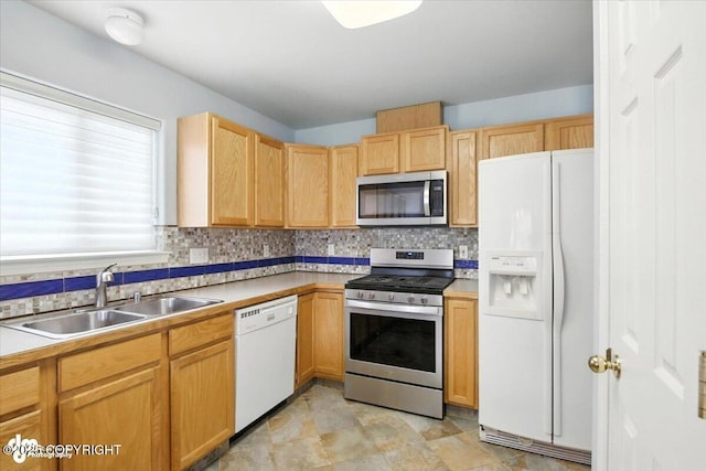 7851 Alpine View Cir, Anchorage, AK 99507 - kitchen featuring appliances with stainless steel finishes, tasteful backsplash, light countertops, and light brown cabinetry