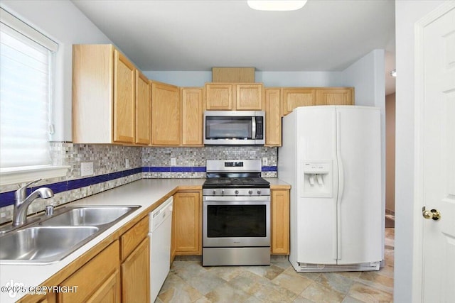 7851 Alpine View Cir, Anchorage, AK 99507 - kitchen with appliances with stainless steel finishes, tasteful backsplash, light brown cabinets, light countertops, and stone finish floors