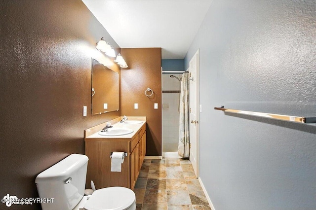 7851 Alpine View Cir, Anchorage, AK 99507 - bathroom with stone finish floors, vanity, a textured wall, and a shower with curtain
