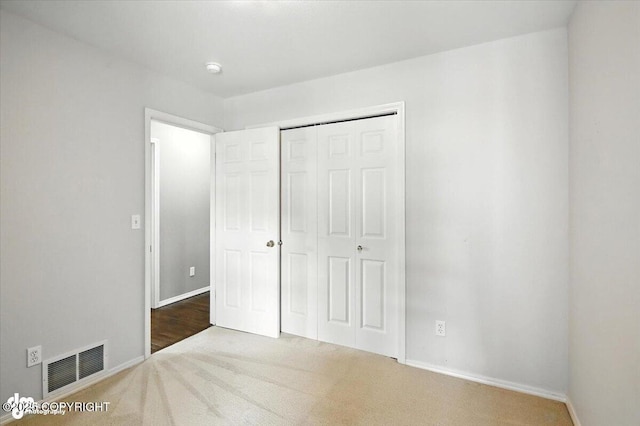 7851 Alpine View Cir, Anchorage, AK 99507 - unfurnished bedroom featuring carpet flooring and a closet