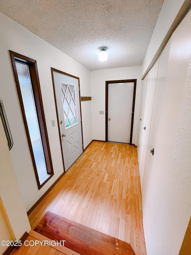 505 Unimak St, Petersburg, AK 99833 - entryway featuring light wood-style floors and a textured ceiling
