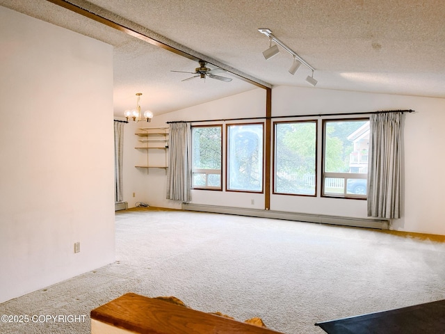 505 Unimak St, Petersburg, AK 99833 - spare room with a baseboard radiator, carpet floors, lofted ceiling, a chandelier, and a textured ceiling