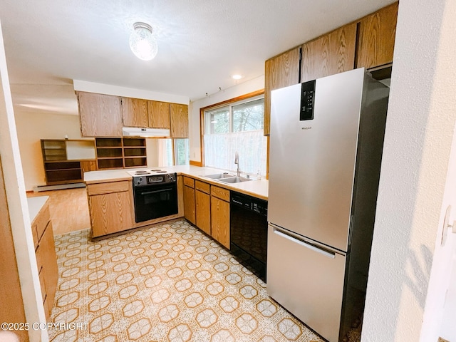 505 Unimak St, Petersburg, AK 99833 - kitchen featuring freestanding refrigerator, dishwasher, under cabinet range hood, electric range oven, and light countertops