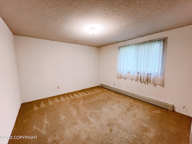 505 Unimak St, Petersburg, AK 99833 - spare room featuring a baseboard heating unit, carpet floors, and a textured ceiling