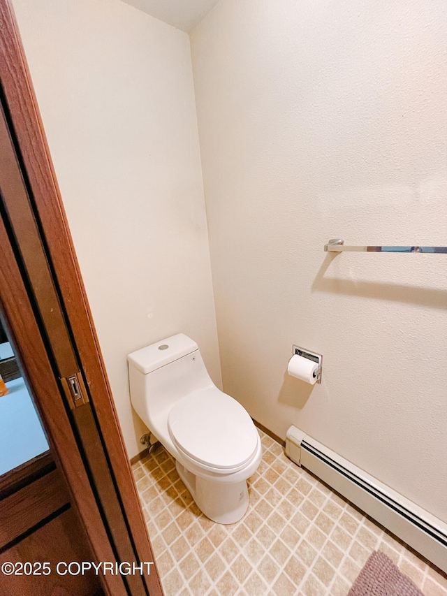 505 Unimak St, Petersburg, AK 99833 - bathroom featuring baseboard heating and toilet