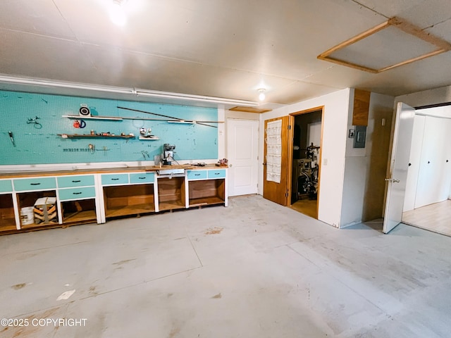 505 Unimak St, Petersburg, AK 99833 - miscellaneous room with a workshop area, concrete floors, and electric panel