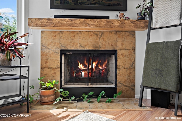 9166 Eagle River Ln, Eagle River, AK 99577 - detailed view of a tile fireplace and wood finished floors