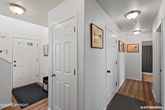 9166 Eagle River Ln, Eagle River, AK 99577 - hallway featuring wood finished floors and baseboards