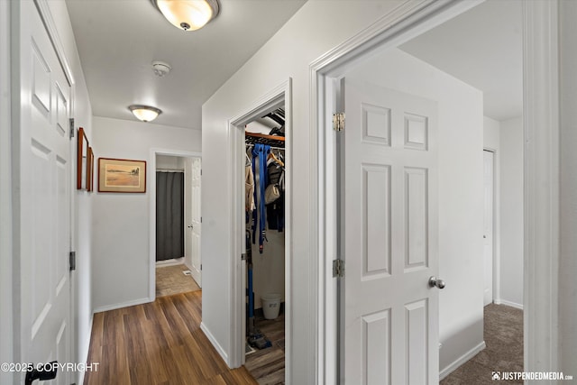 9166 Eagle River Ln, Eagle River, AK 99577 - hallway featuring baseboards and dark wood finished floors