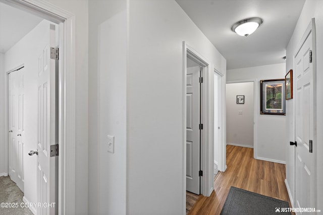 9166 Eagle River Ln, Eagle River, AK 99577 - hall featuring baseboards and wood finished floors