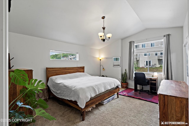 9166 Eagle River Ln, Eagle River, AK 99577 - carpeted bedroom featuring vaulted ceiling, multiple windows, a chandelier, a wall mounted AC, and a desk