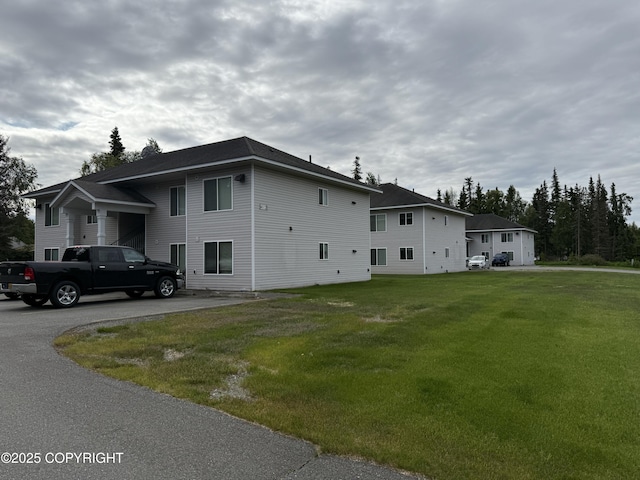 408 Eadies Way, Kenai, AK 99611 - view of side of home featuring a yard