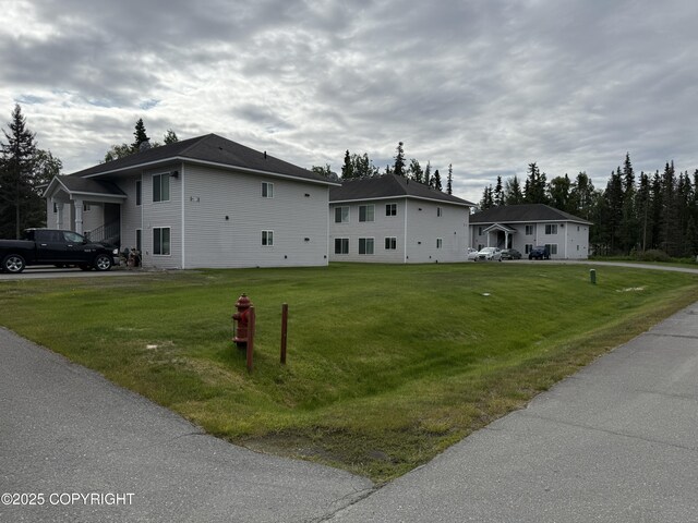 408 Eadies Way, Kenai, AK 99611 - view of home's exterior with a yard
