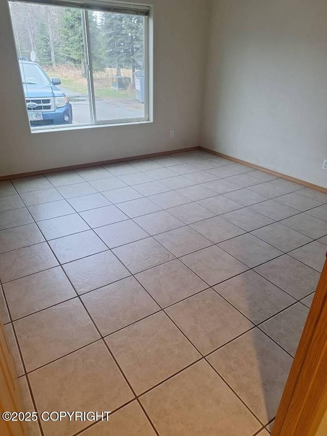 408 Eadies Way, Kenai, AK 99611 - unfurnished room with light tile patterned flooring and baseboards