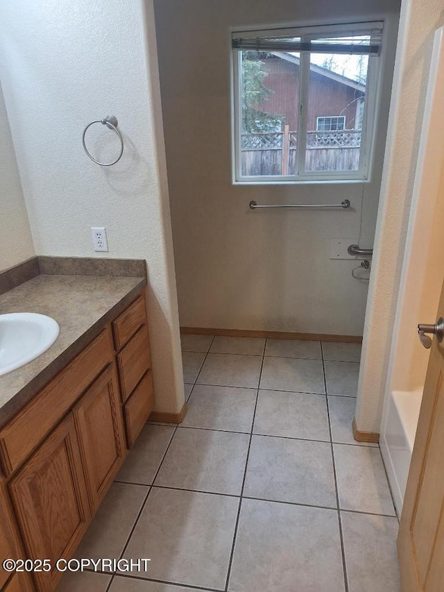 408 Eadies Way, Kenai, AK 99611 - bathroom featuring vanity, a tub, and tile patterned flooring
