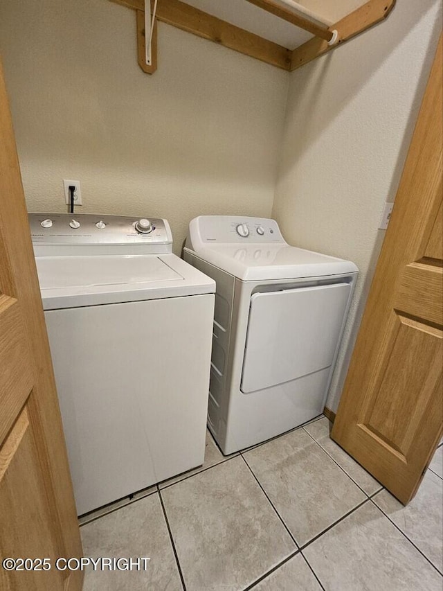 408 Eadies Way, Kenai, AK 99611 - washroom with separate washer and dryer and light tile patterned floors