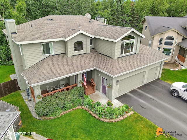 3931 Moonstar Cir, Anchorage, AK 99516 - view of front of home with roof with shingles, a chimney, driveway, and covered porch