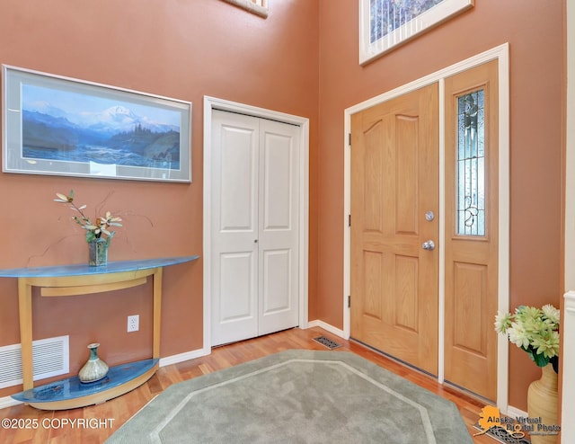 3931 Moonstar Cir, Anchorage, AK 99516 - entrance foyer with wood finished floors and baseboards