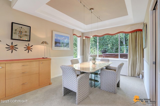 3931 Moonstar Cir, Anchorage, AK 99516 - dining room with a tray ceiling and light carpet