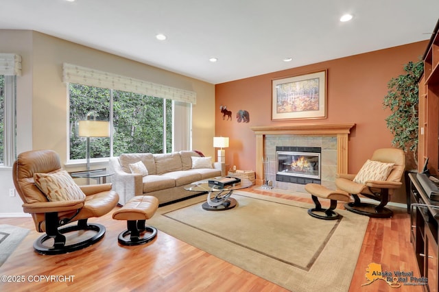 3931 Moonstar Cir, Anchorage, AK 99516 - living area with wood finished floors, recessed lighting, and a tile fireplace