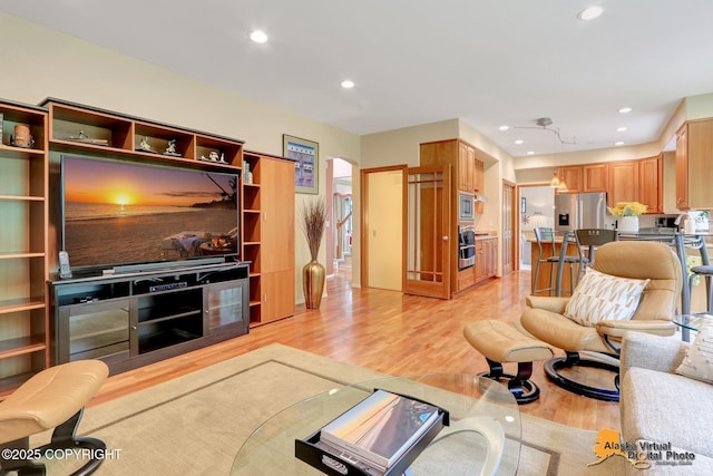 3931 Moonstar Cir, Anchorage, AK 99516 - living area featuring light wood-style floors, recessed lighting, and arched walkways