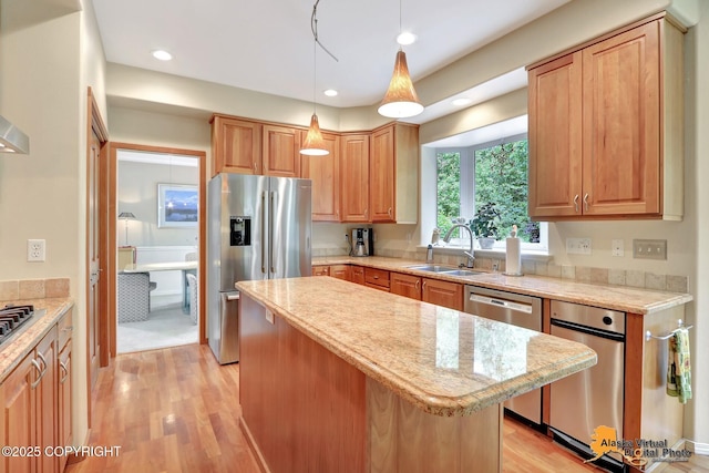 3931 Moonstar Cir, Anchorage, AK 99516 - kitchen featuring stainless steel appliances, light wood-style flooring, a center island, light stone counters, and recessed lighting