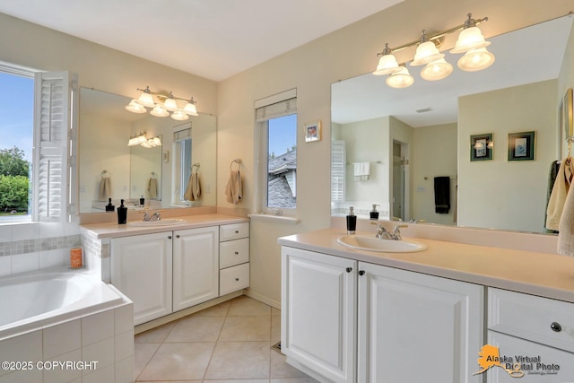 3931 Moonstar Cir, Anchorage, AK 99516 - full bath with healthy amount of natural light, two vanities, a garden tub, and tile patterned floors