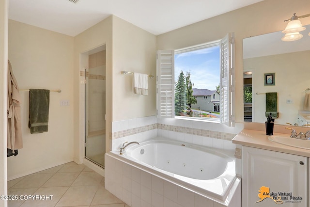 3931 Moonstar Cir, Anchorage, AK 99516 - bathroom featuring a whirlpool tub, vanity, a stall shower, and tile patterned floors