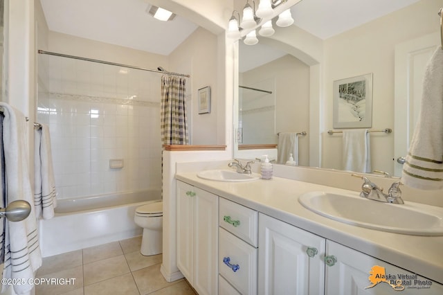 3931 Moonstar Cir, Anchorage, AK 99516 - full bath featuring tile patterned floors, double vanity, and shower / bath combo with shower curtain