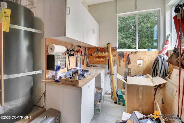 3931 Moonstar Cir, Anchorage, AK 99516 - kitchen with white cabinetry, light countertops, and strapped water heater