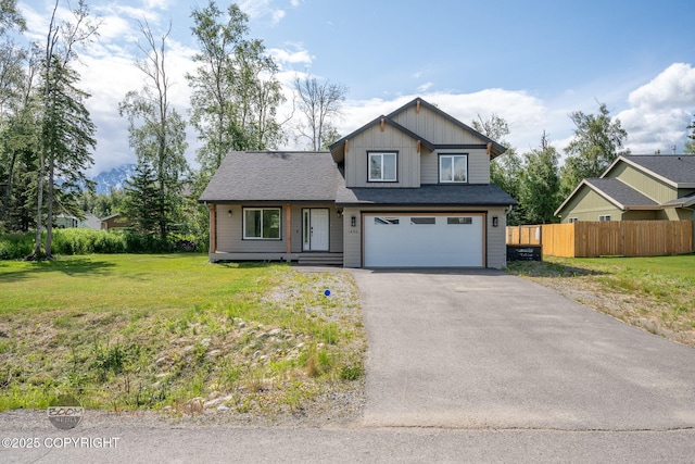 1460 E Esty Dr, Palmer, AK 99645 - view of front of house featuring asphalt driveway, a garage, and board and batten siding