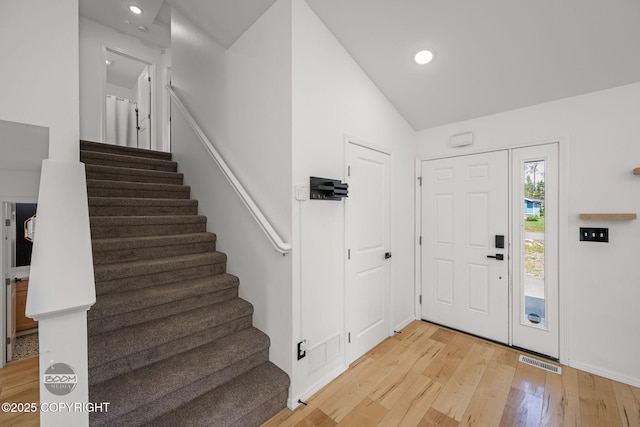 1460 E Esty Dr, Palmer, AK 99645 - entrance foyer with stairs, light wood finished floors, lofted ceiling, and recessed lighting