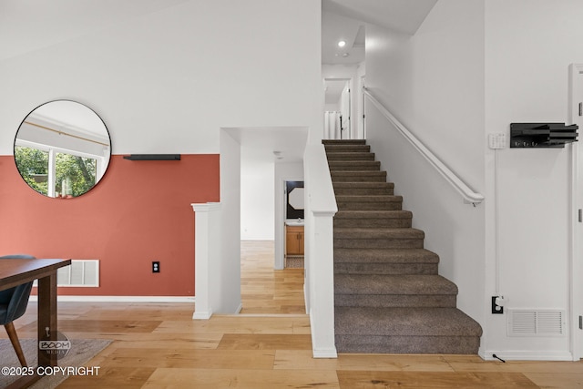 1460 E Esty Dr, Palmer, AK 99645 - stairs with wood finished floors, recessed lighting, and a towering ceiling