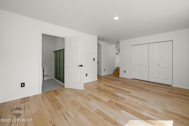 1460 E Esty Dr, Palmer, AK 99645 - unfurnished bedroom featuring light wood-style floors, a closet, recessed lighting, and ensuite bath