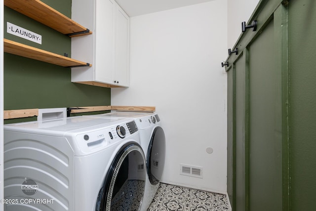1460 E Esty Dr, Palmer, AK 99645 - laundry area featuring washer and clothes dryer, cabinet space, and a barn door