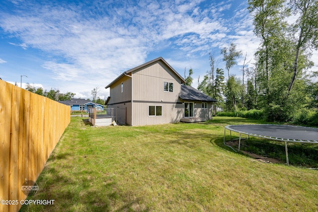 1460 E Esty Dr, Palmer, AK 99645 - back of house featuring a trampoline