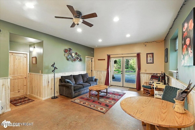 18095 Langille Rd, Cooper Landing, AK 99572 - carpeted living room with a wainscoted wall, ceiling fan, wood walls, and recessed lighting