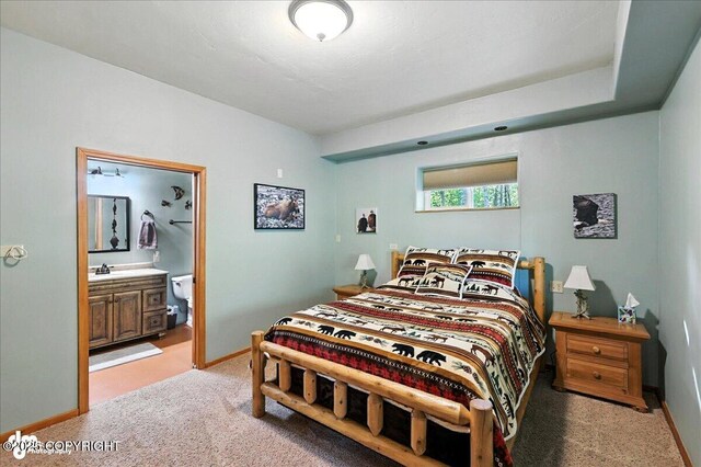 18095 Langille Rd, Cooper Landing, AK 99572 - bedroom featuring light carpet and ensuite bath