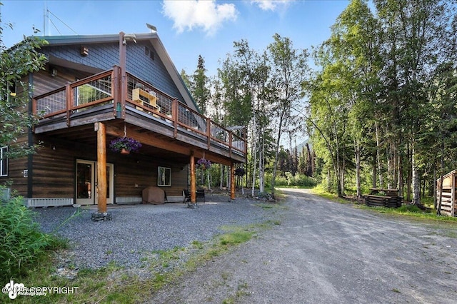 18095 Langille Rd, Cooper Landing, AK 99572 - rear view of house featuring a deck and driveway