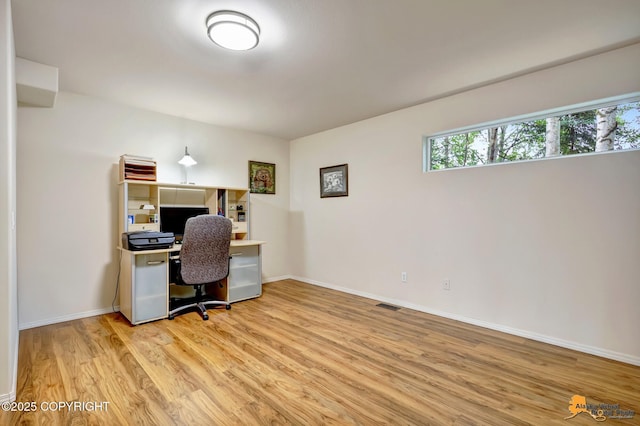 7862 Spruce St Unit 7B, Anchorage, AK 99507 - office area with light wood-style floors and baseboards
