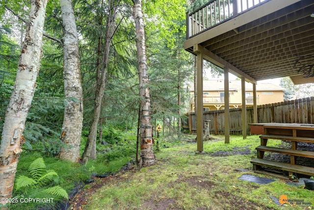 7862 Spruce St Unit 7B, Anchorage, AK 99507 - view of yard with a wooden deck